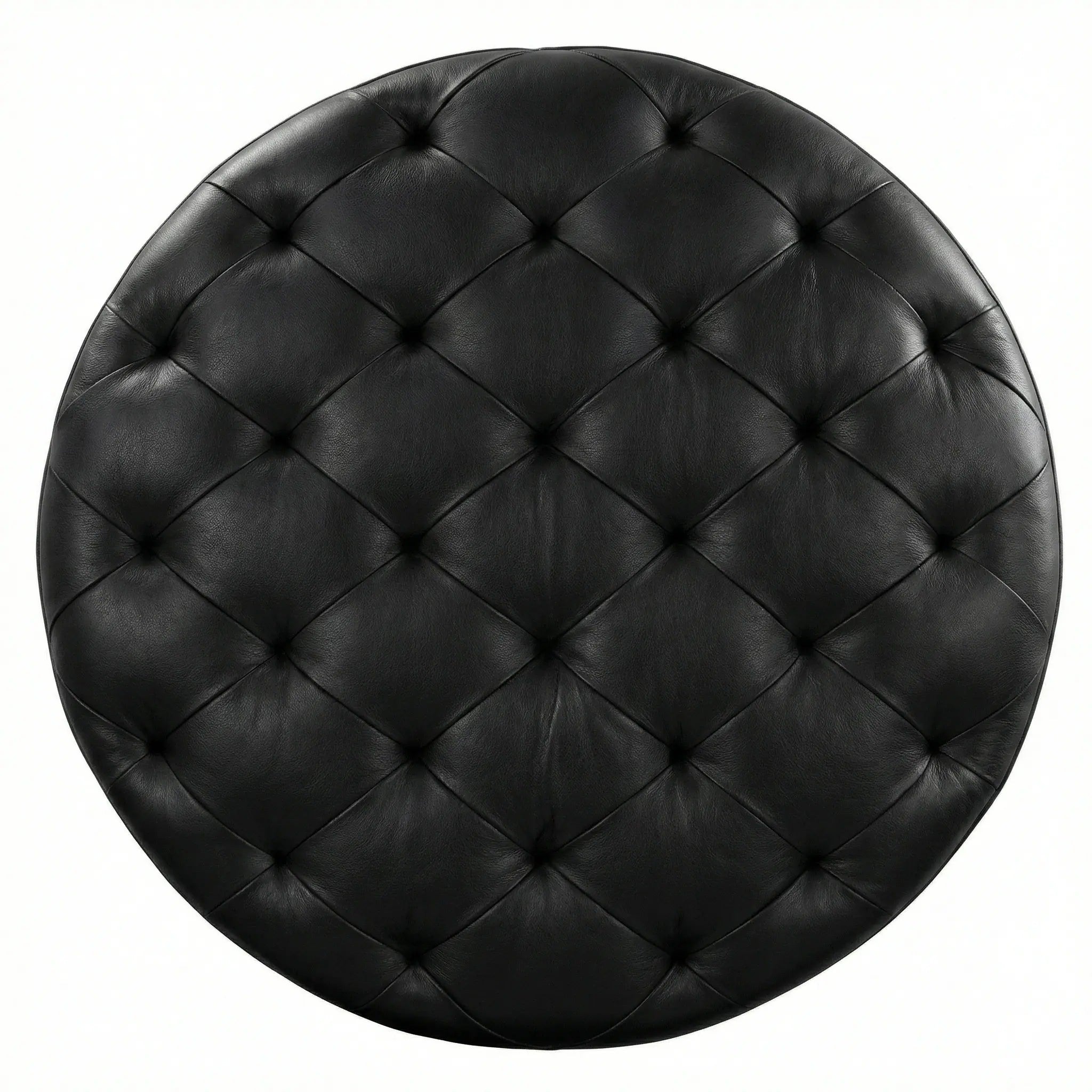 Moroccan Leather Pouf black leather ottoman in a living room setting with a beige sofa and plant.